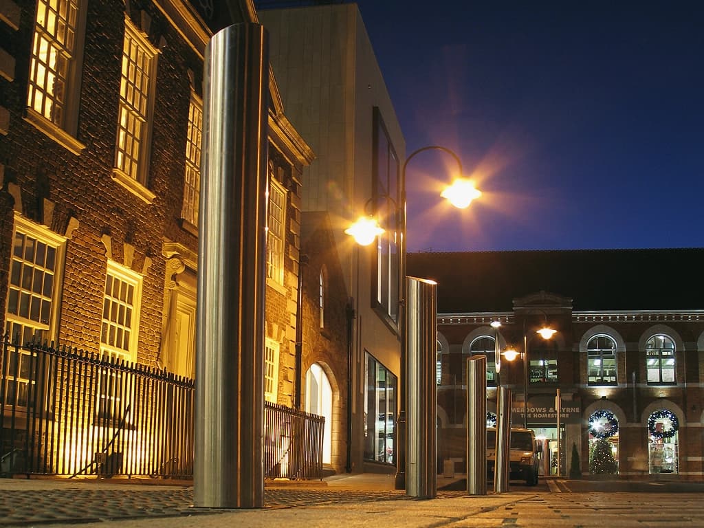 Stainless steel bollards in cork at night